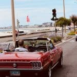 red convertible car on road during daytime